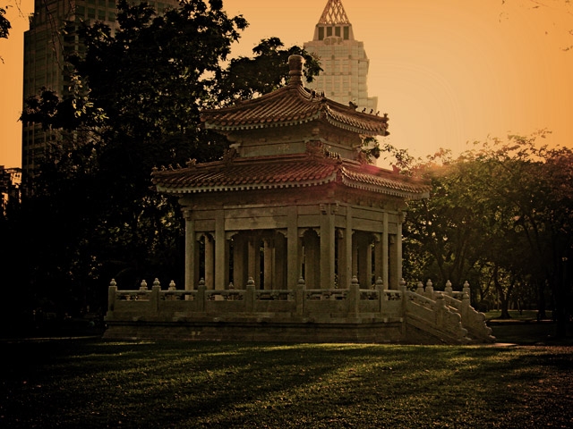 Sun Sets Over The Temple in Lumpini Park